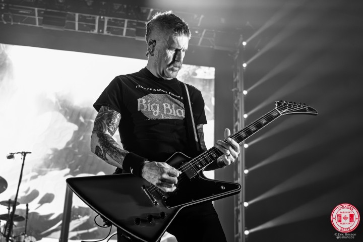 Mastodon performing under dramatic stage lighting at MTELUS in Montreal.
