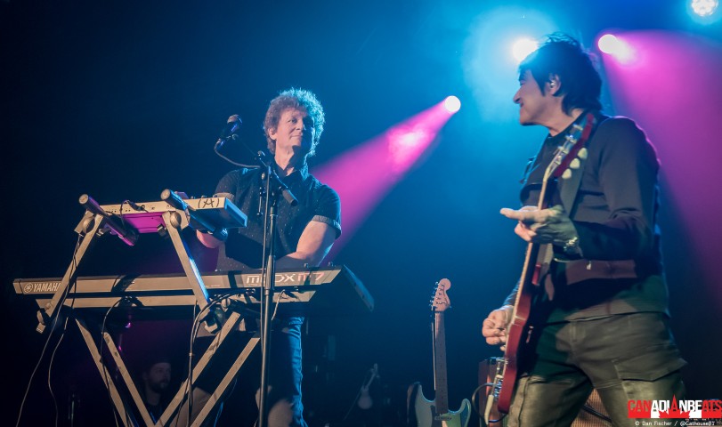 Spoons keyboardist and guitarist performing together under blue and pink stage lights at Maxwell's in Waterloo.