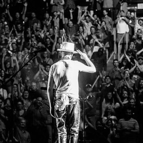 Gord Downie, lead singer of The Tragically Hip, performing on stage.